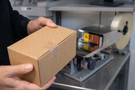 Hand-Applying Tamper-Evident Labels to Boxes? A Smarter, More Consistent Alternative